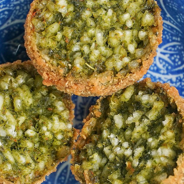 Close up of Gluten-free, Low FODMAP vegan basil and macadamia arancini.