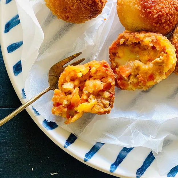 Close up of Gluten-free, Low FODMAP (onion & garlic free) beef bolognese and mozzarella arancini.