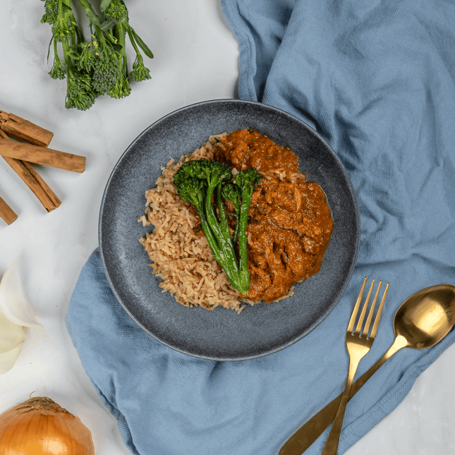 High protein butter chicken curry with tender chicken in a creamy cashew yoghurt sauce, gluten free and on a plate. 