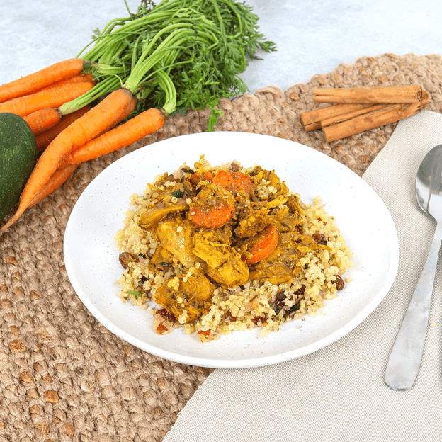 Chicken & Spiced Carrots w/ Roasted Almond & Cranberry Quinoa on plate. This meal is Low FODMAP, Lactose Free, Gluten Free