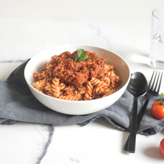 Pasta bolognese in a bowl. This meals is gluten free, lactose free, onion and garlic free, and low FODMAP. 