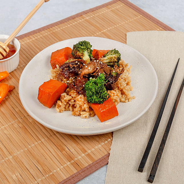 Honey Soy Chicken w/ Roasted Carrots, Broccoli & Brown Rice on plate. This meal is gluten free and lactose free. 