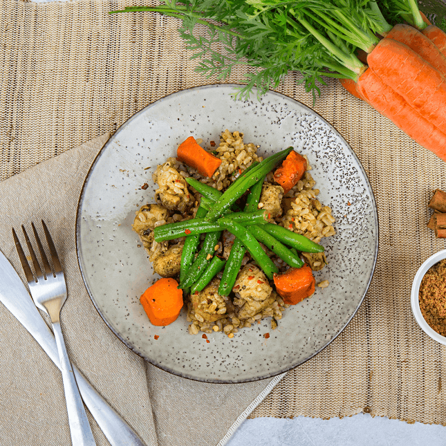 Jamaican Chicken w/ Lime Rice, Roasted Carrots & Green Beans in bowl. This meals is Gluten Free, Low FODMAP and Lactose Free. 