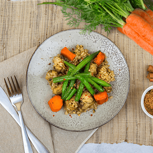 Jamaican Chicken w/ Lime Rice, Roasted Carrots & Green Beans in bowl. This meals is Gluten Free, Low FODMAP and Lactose Free. 