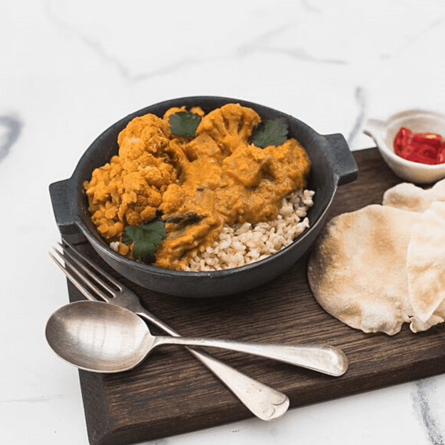 Pumpkin & Lentil Dahl w/ Spinach, Yoghurt & Spiced Cauliflower in bowl. This meals is gluten Free, Lactose Free, Vegan, onion & garlic free